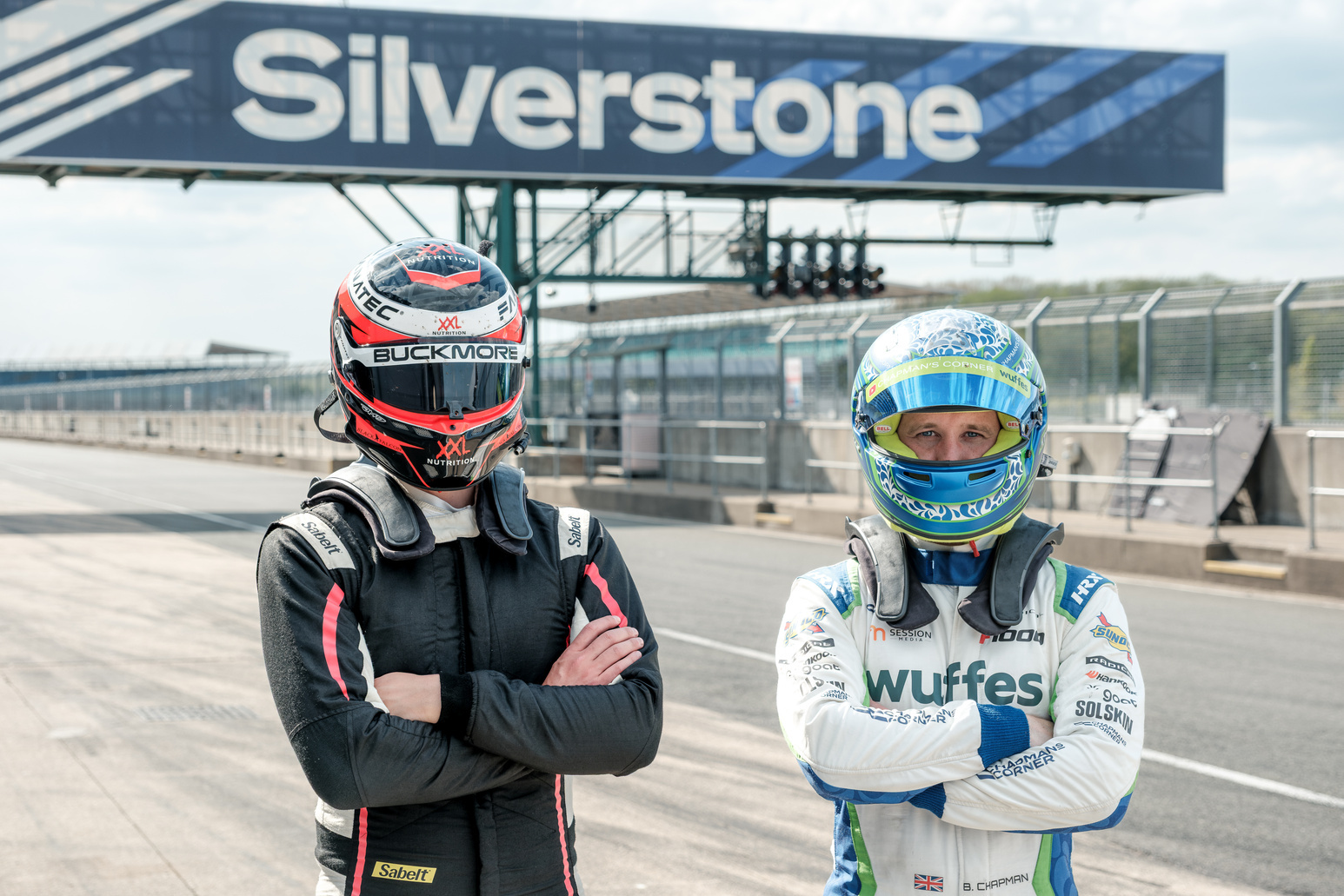 Super GT and Bert Chapman in their racing suits and helmets at Silverstone